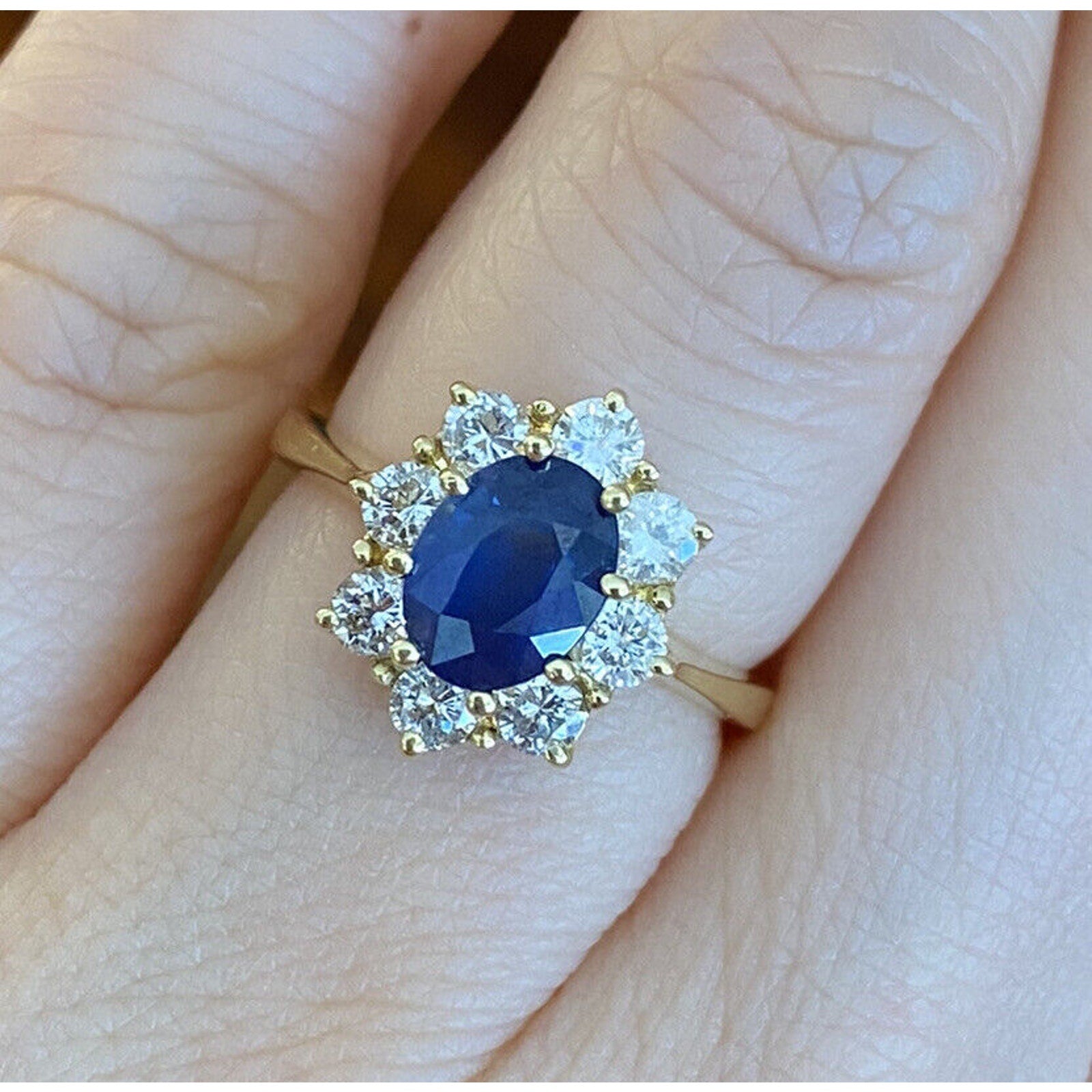 1.63 carat Oval Sapphire and Diamond Halo Ring in 18k Yellow Gold