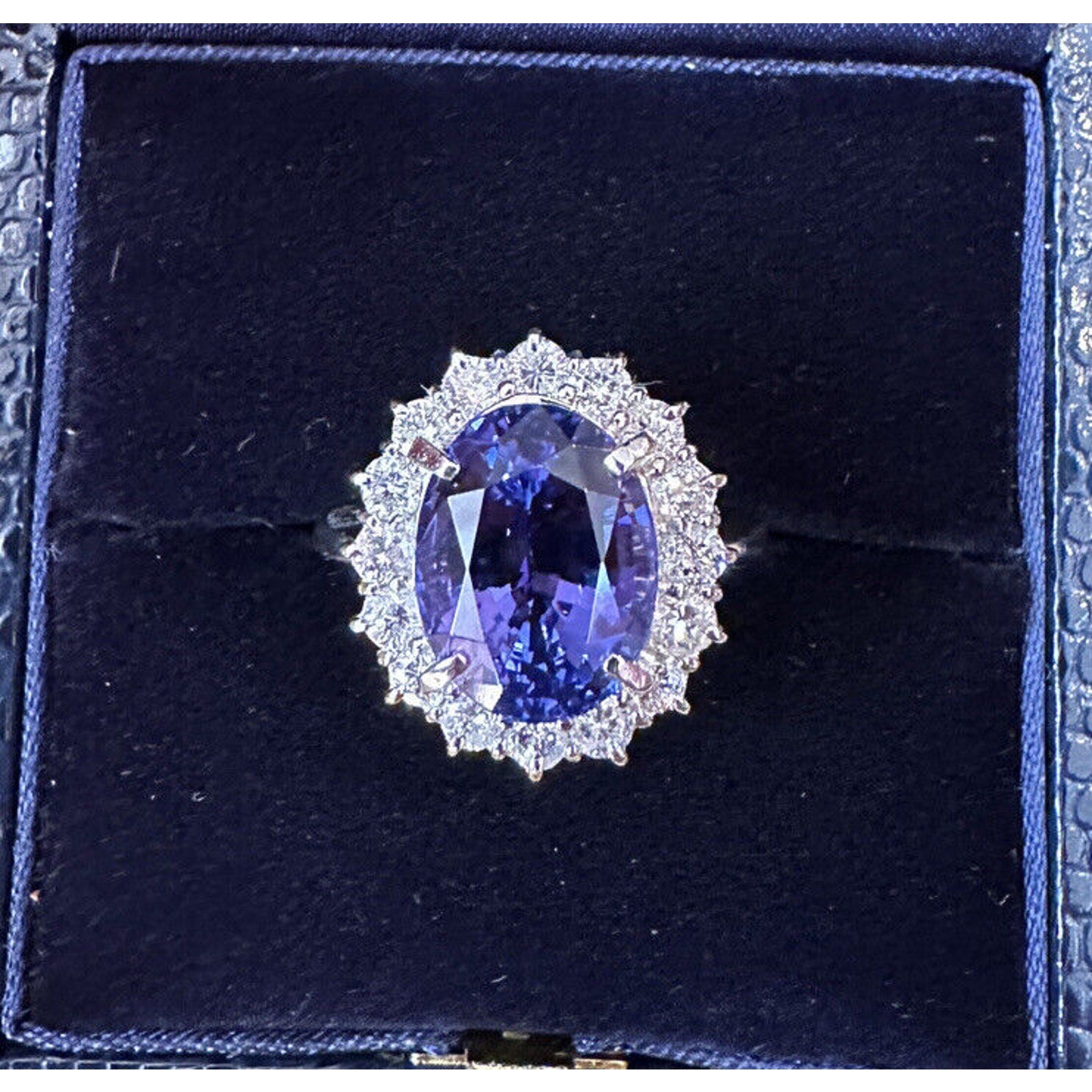 Estate 6.63 carats Oval Tanzanite Ring with Halo Diamond in Platinum