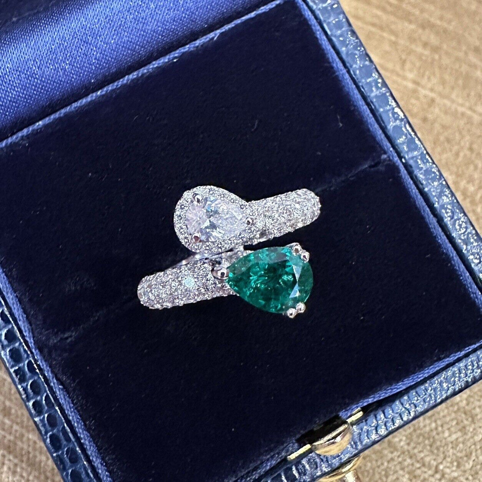 Pear Emerald and Pear Diamond Crossover Ring in 18k White Gold