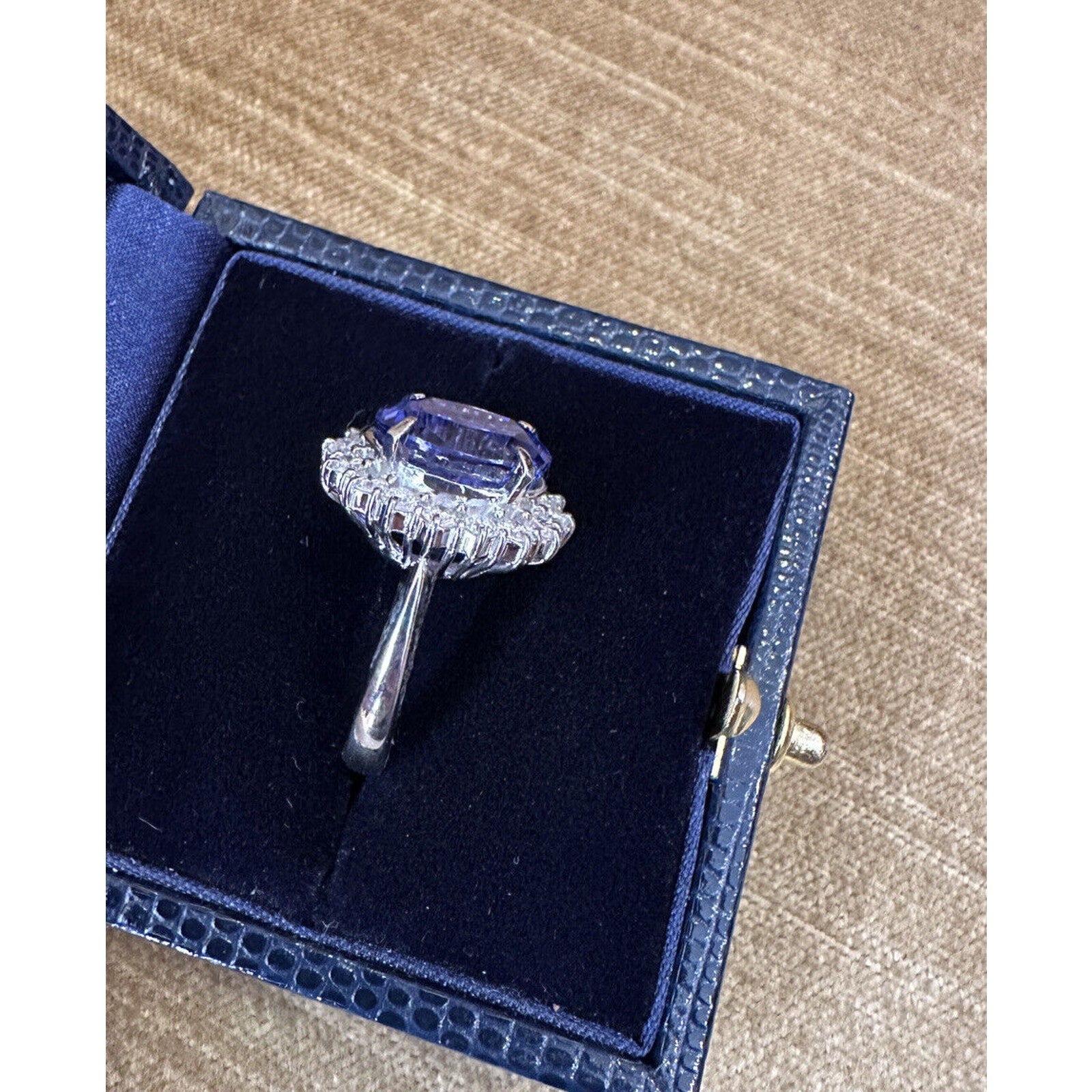 Estate 6.63 carats Oval Tanzanite Ring with Halo Diamond in Platinum