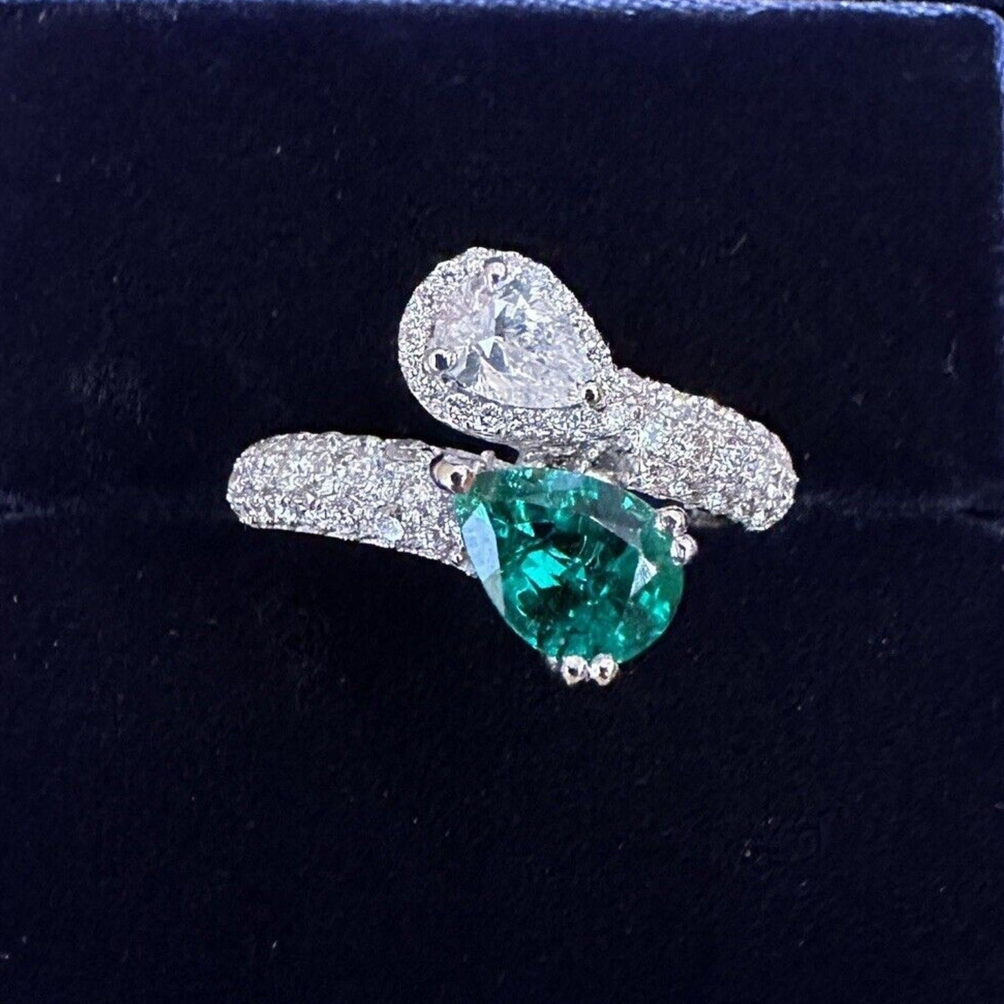 Pear Emerald and Pear Diamond Crossover Ring in 18k White Gold