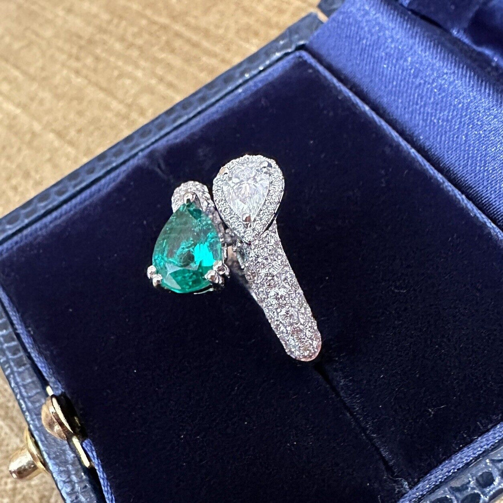 Pear Emerald and Pear Diamond Crossover Ring in 18k White Gold