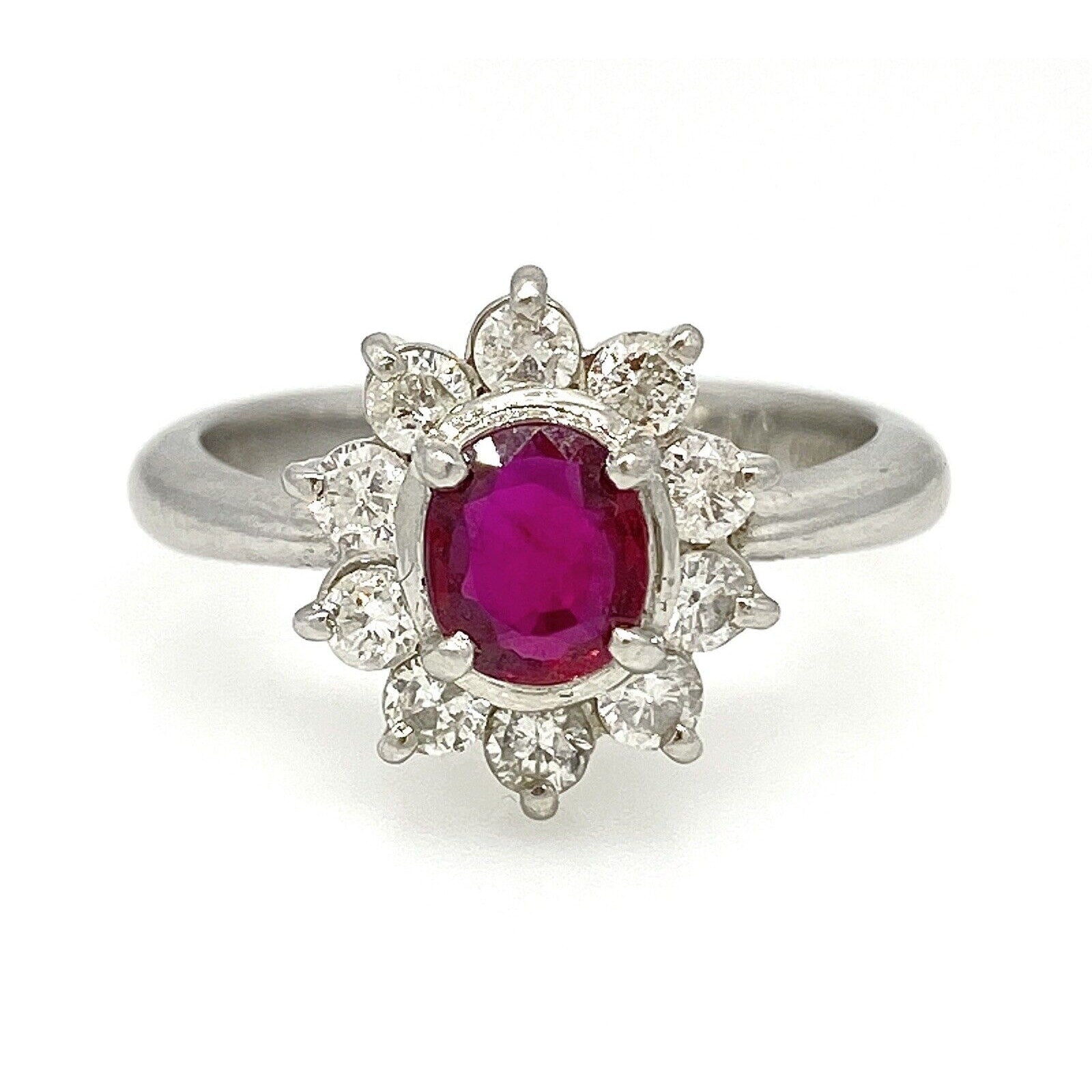 Oval Ruby and Round Diamond Halo Ring in Platinum