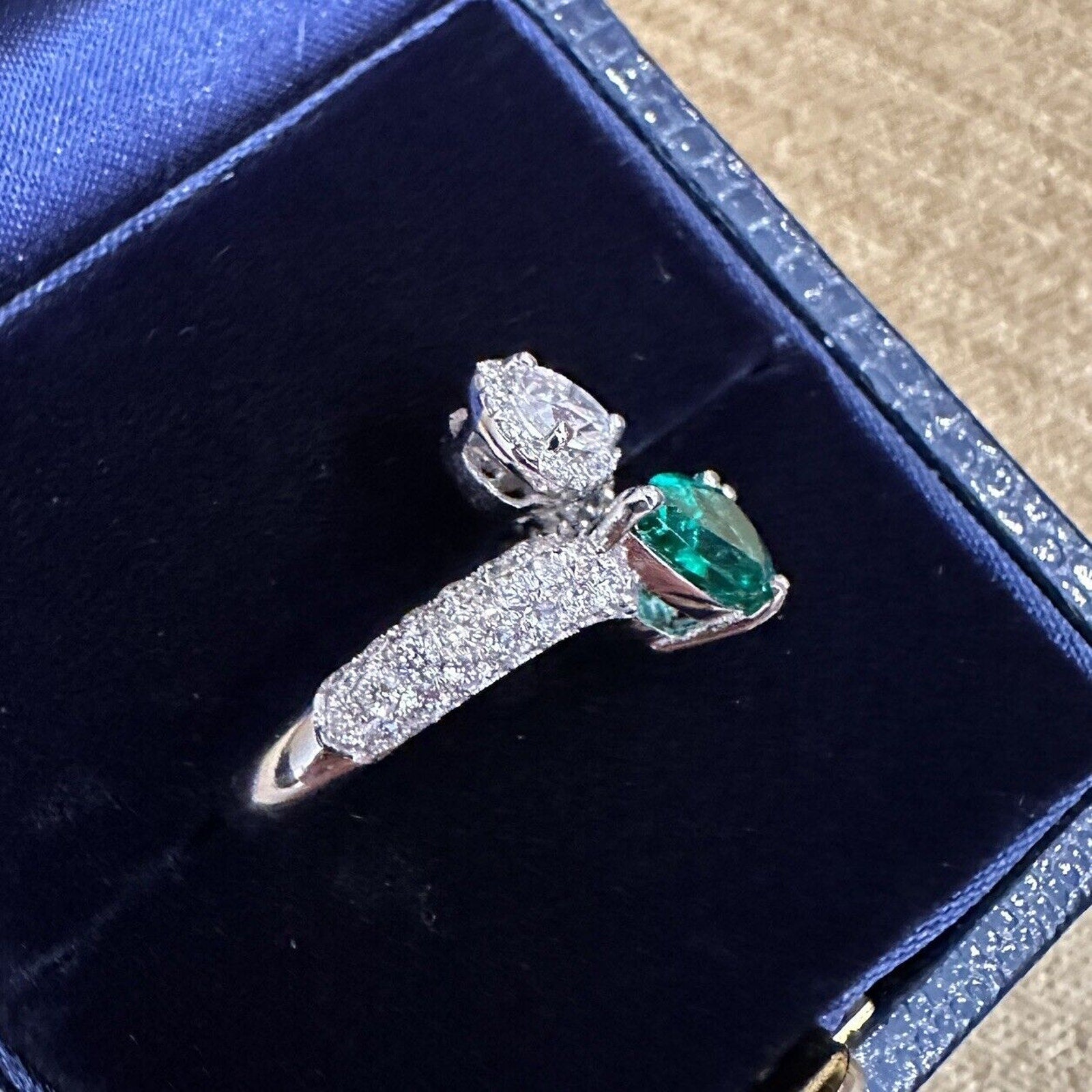 Pear Emerald and Pear Diamond Crossover Ring in 18k White Gold