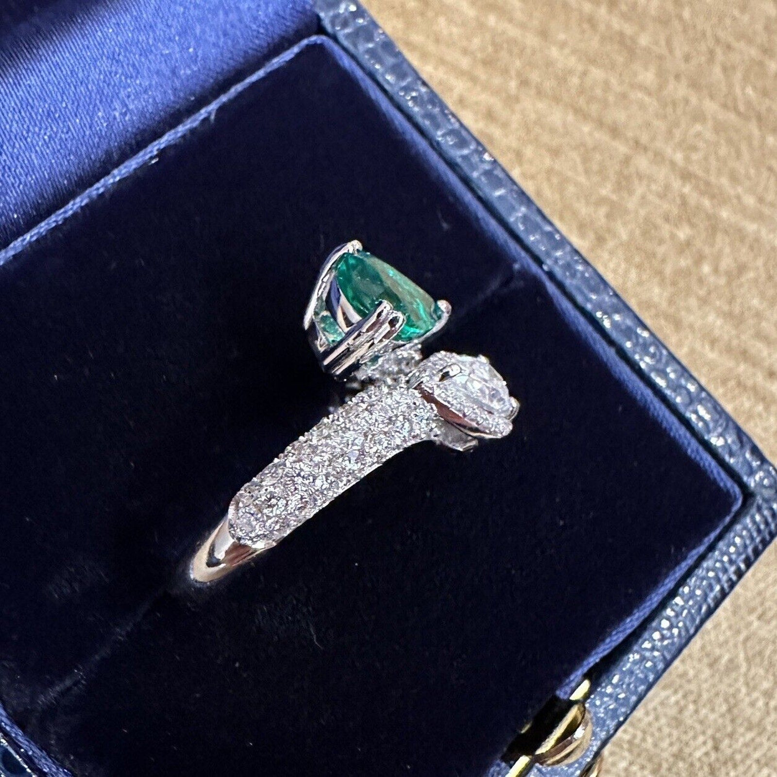 Pear Emerald and Pear Diamond Crossover Ring in 18k White Gold