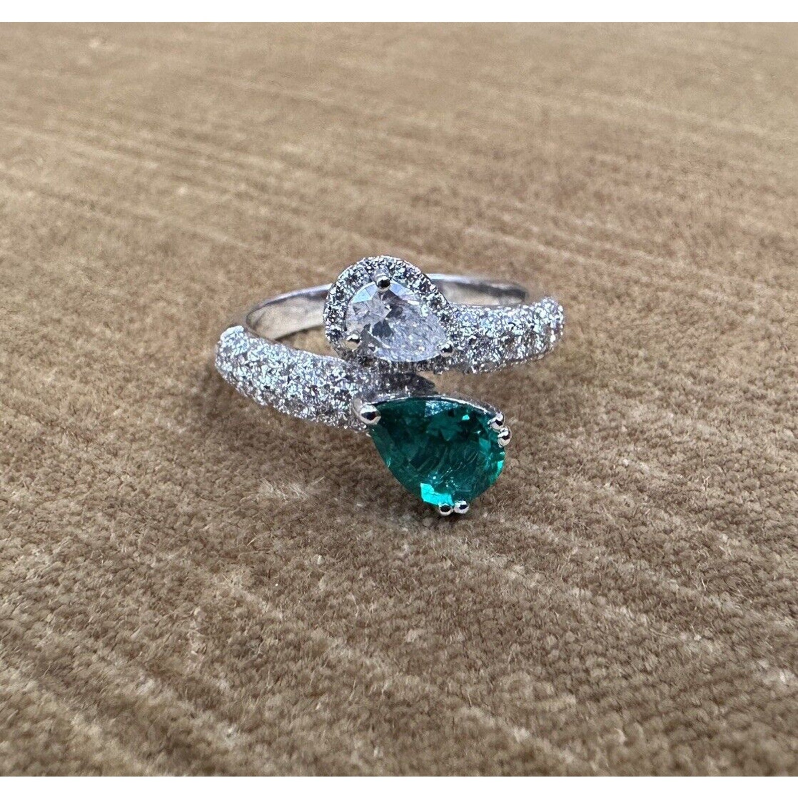 Pear Emerald and Pear Diamond Crossover Ring in 18k White Gold